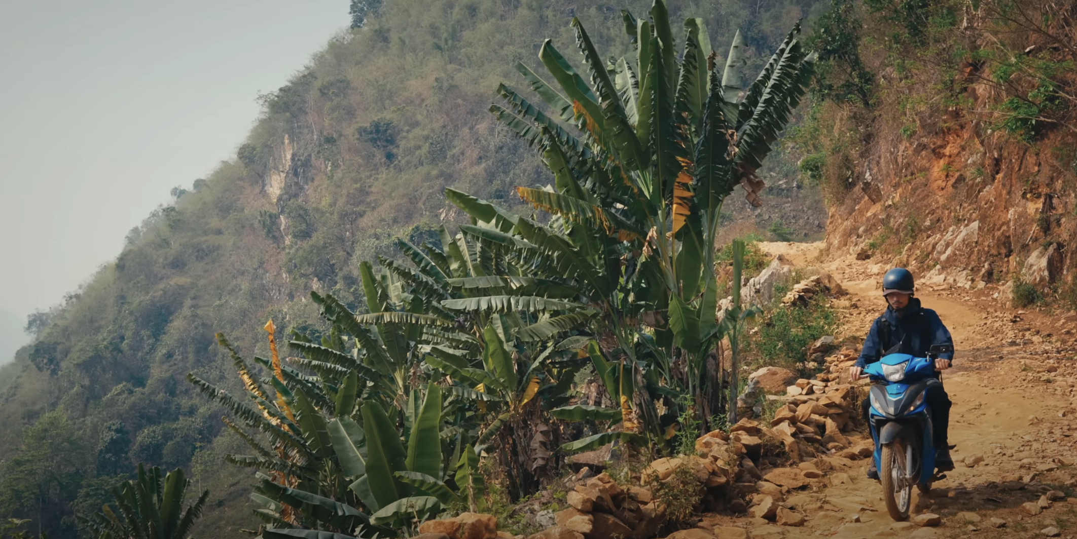 Den Vau riding a bike to the northern highlands of Vietnam